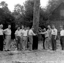 Local Citizens Lend a Hand at Setting 60-Foot Poles for Memorial Stadium